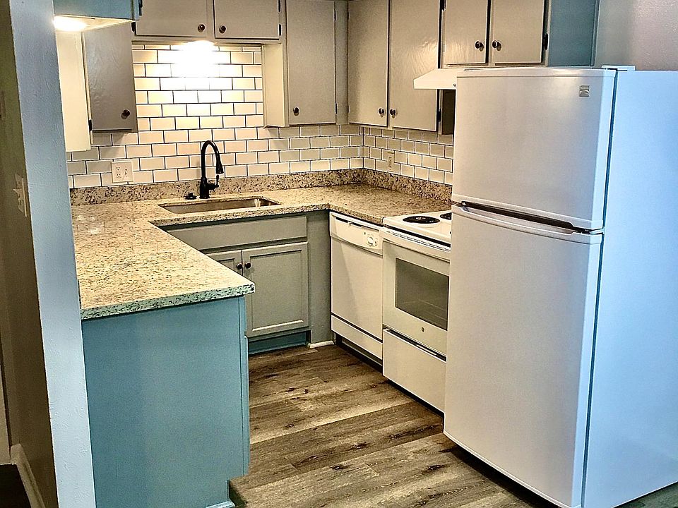 Granite countertops, modern subway backsplash, new appliances, and LED fixtures.