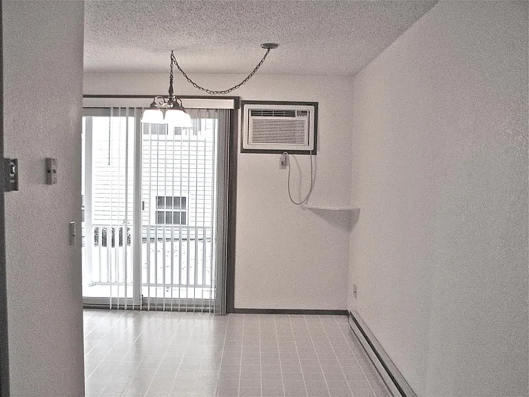 Dining area, small deck outside patio door, through the wall a/c