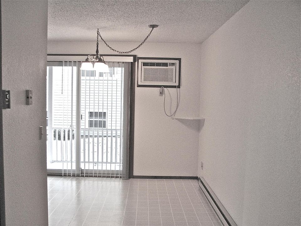 Dining area, small deck outside patio door, through the wall a/c