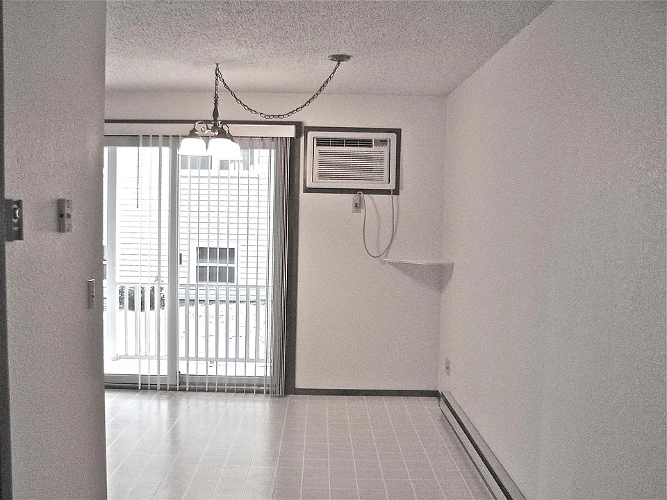 Dining area, small deck outside patio door, through the wall a/c