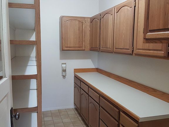 Large Walk-In Pantry with tons of shelves and cabinets