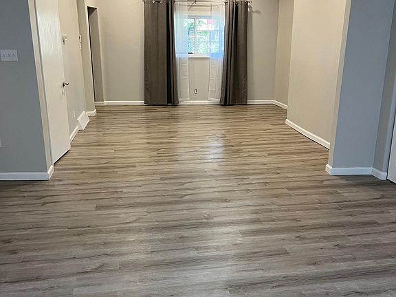 Enter from Niggel Street living area looking to dining area. Recessed lighting and remote control ceiling fans in
Both rooms.