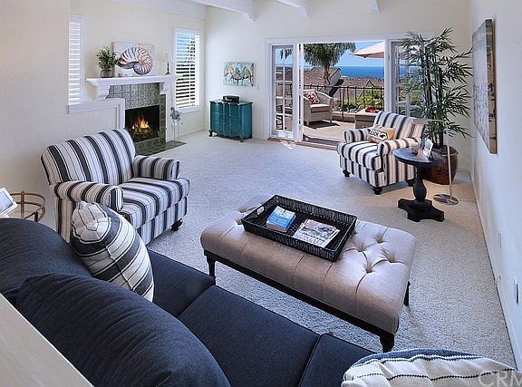 Living Room with Fireplace opens to Deck