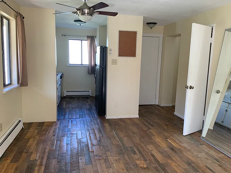 Open floor plan with a nice storage closet off the living room. Ceiling fans in the living room and primary bedroom.