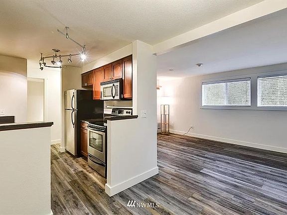 Spacious first floor with cozy dining area, spacious living room, and functional galley kitchen with plenty of storage. Kitchen appliances included! (Stainless steel fridge/freezer, dish washer, stove/oven, microwave.)