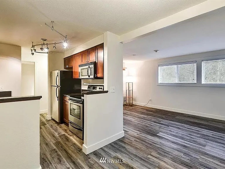 Spacious first floor with cozy dining area, spacious living room, and functional galley kitchen with plenty of storage. Kitchen appliances included! (Stainless steel fridge/freezer, dish washer, stove/oven, microwave.)