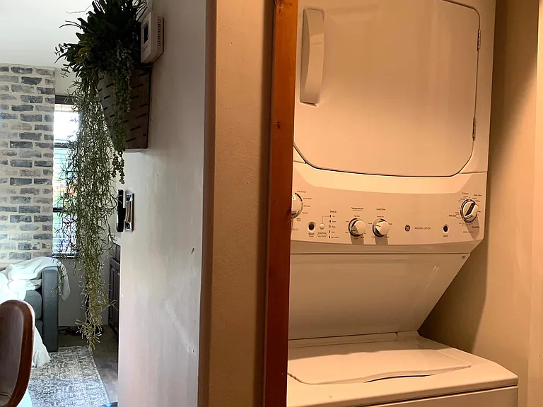 Stack Washer/Dryer with Clothes Closet across.