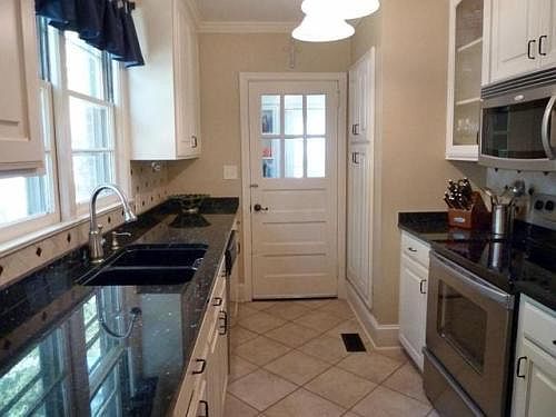Granite countertops, stainless appliances, tile floors, tile