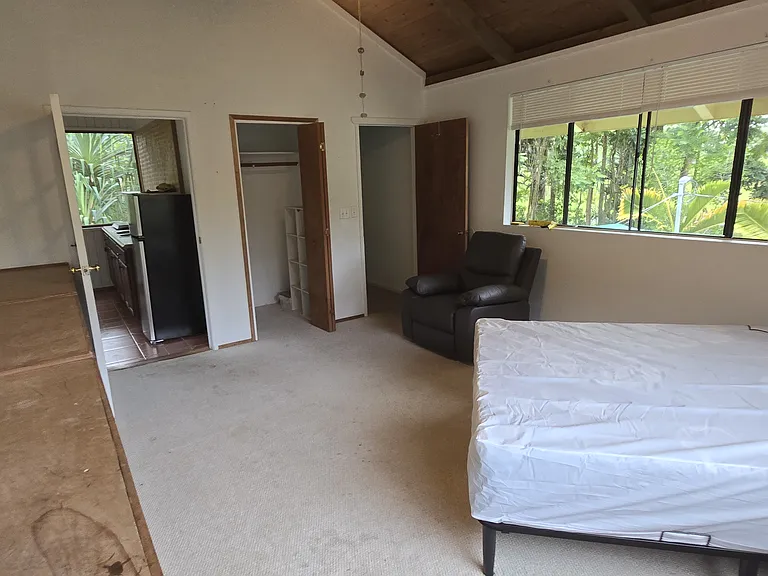 Kitchen to the left, closet in the middle and bathroom on the right.