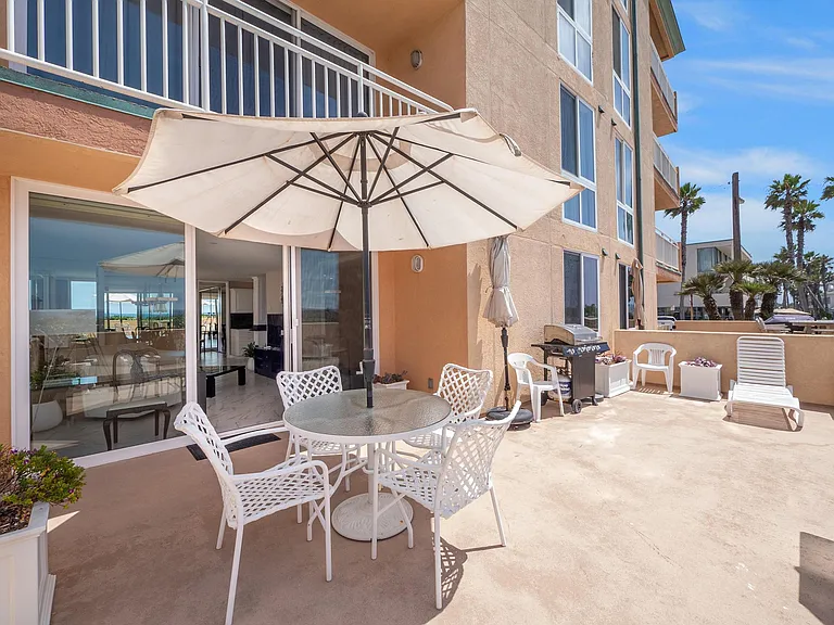 large private patio with two sets of tables and chairs and barbecue; two chaise lounges (not shown in picture)