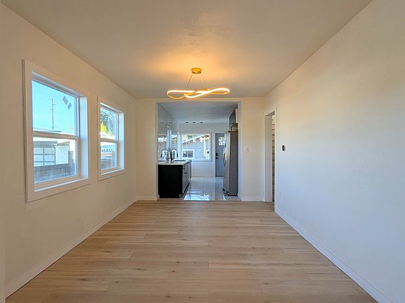 Spacious Dining Room Leading to Kitchen