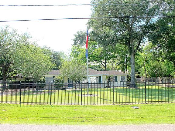 This lovely property is completely fenced and has 2 gated driveways. The main gate is remote controlled and leads to the 2 car carport in front of the converted garage. The second driveway on the other side leads to the shop in the back.