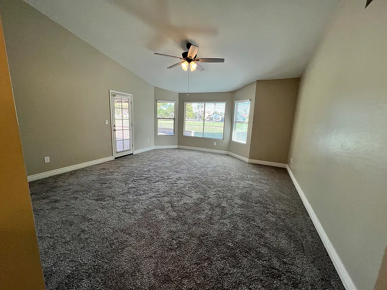 Spacious 19' x 16.6' primary suite offers views of the golf course