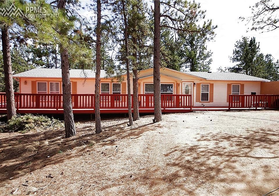 Gorgeous ranch home with beautiful wrap-around deck sitting on 2.14 acres