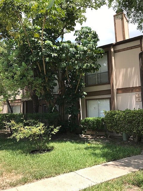 Condo is shaded by trees