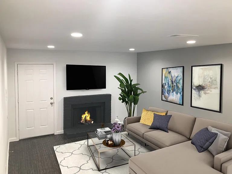 Living Room: Bright and spacious with wood burning fireplace
