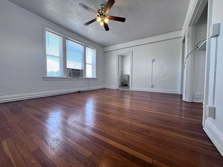 Large windows flood the apartment with natural light.