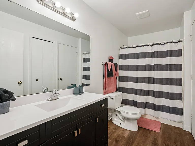 Clean, functional bathrooms feature shower and quality fixtures for everyday convenience, professionally operated by Highlands Vista Group.