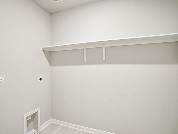 Laundry room in the Oleander floorplan at a Meritage Homes community.