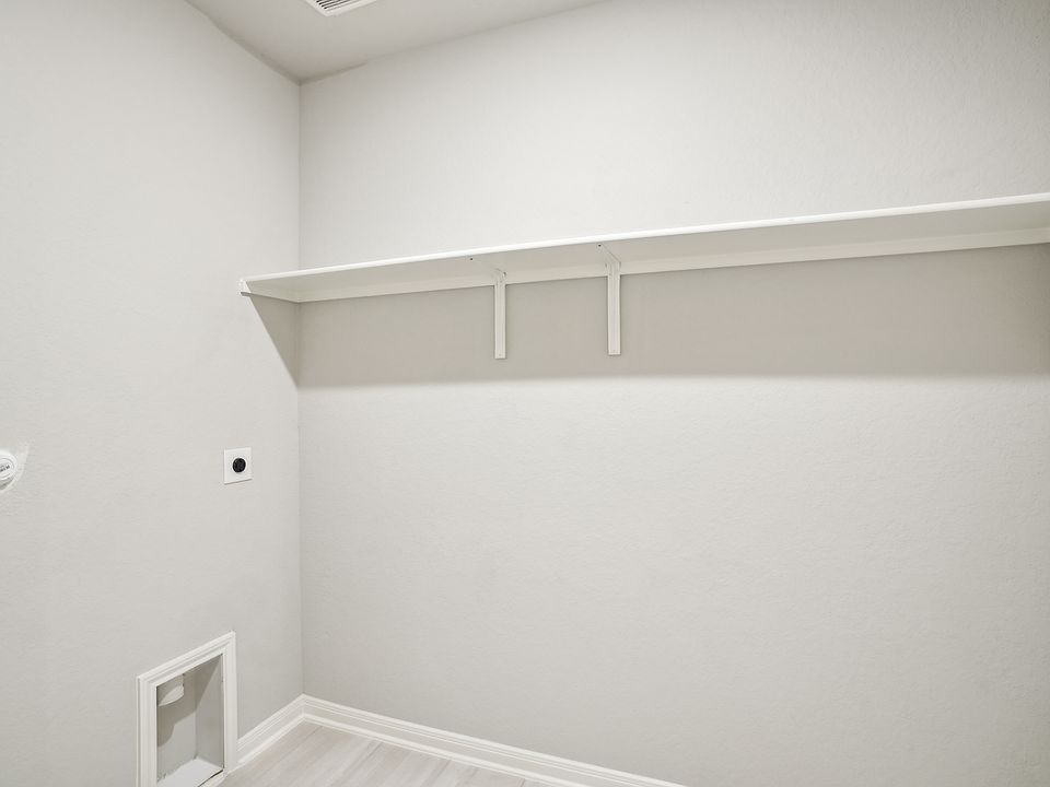 Laundry room in the Oleander floorplan at a Meritage Homes community.