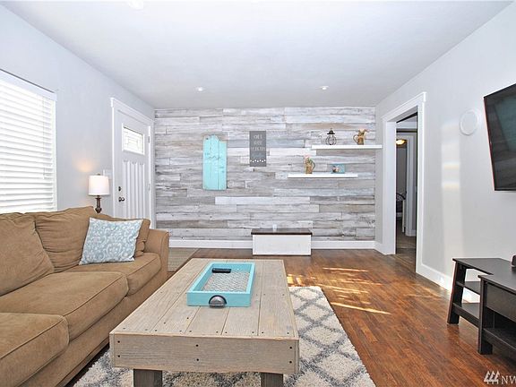 Custom wood wall in this bright and spacious family room.