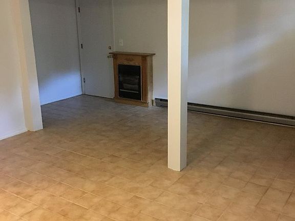 Basement with ceremic tiles, gas fireplace