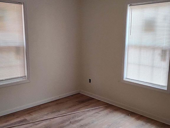 Wood flooring throughout (tile in bathroom)
