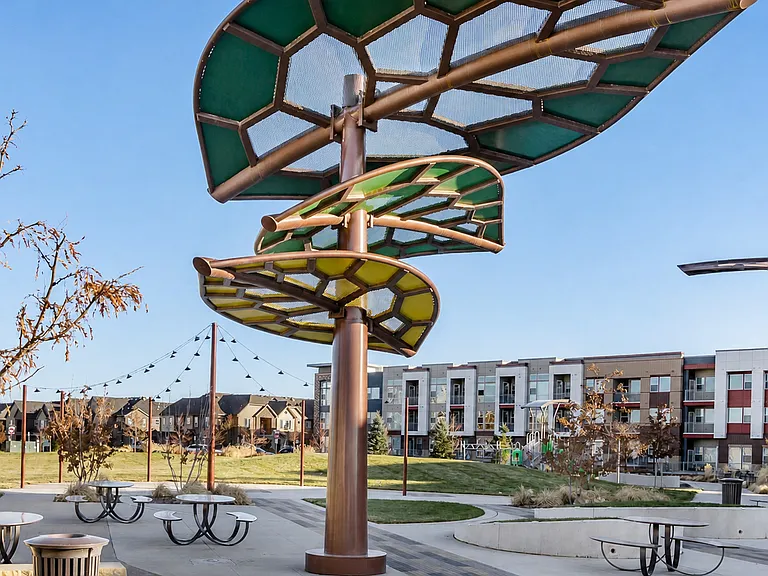 Community gathering area with seating and kids playground