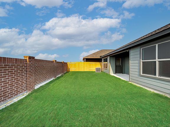 Enjoy a fenced back yard perfect for watching your pets play freely