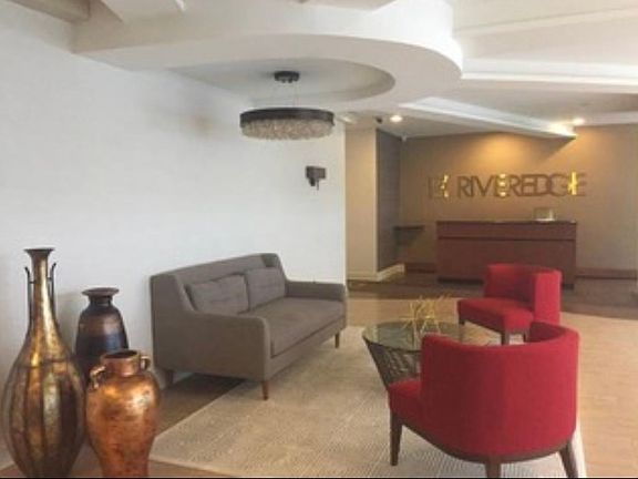 Attractive building lobby with mail rooms close to elevator . A security guard is stationed behind lobby desk between 9pm and I think 6 or 7? a.m. , even though Riveredge rarely, if ever, has any kind of security issues . An extreme