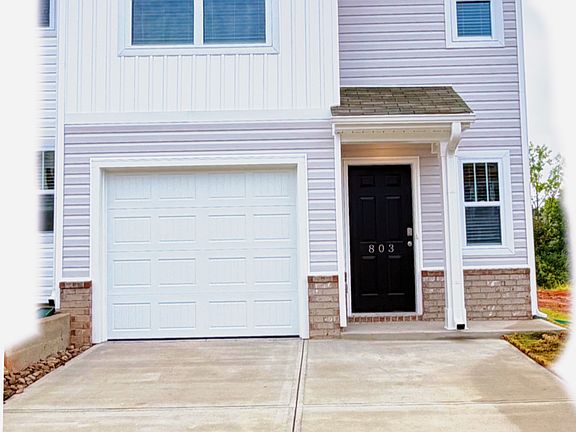 Beautiful end unit. Features 1 car garage