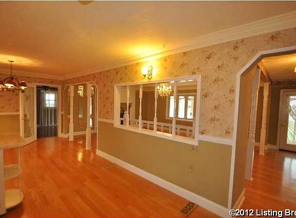 Open living area with views from living room into country kitchen
