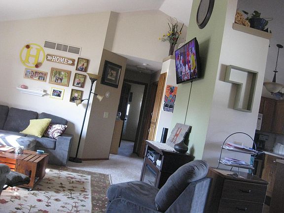 Living room on left; kitchen and dining room on right.