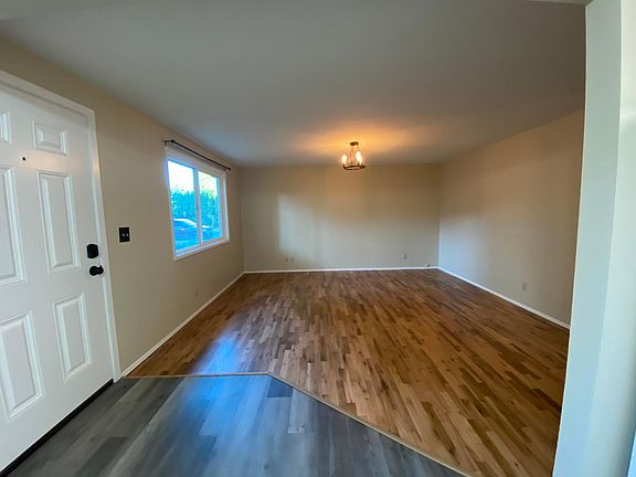 Living room with beautiful refinished hardwood floor.