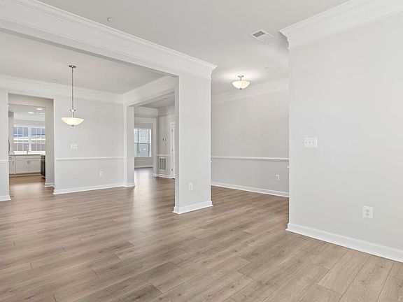The living room and dining room in the Summerfield on homesite 1062 at Lakeside at Trappe by Brookfi