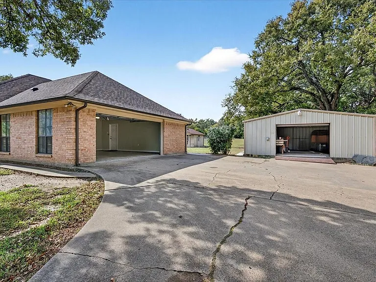 Two car garage and 24 x 32 shop next to the house. Park the truck and tractor here.