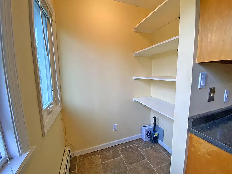 Nook off kitchen - could be used as additional pantry or small work space