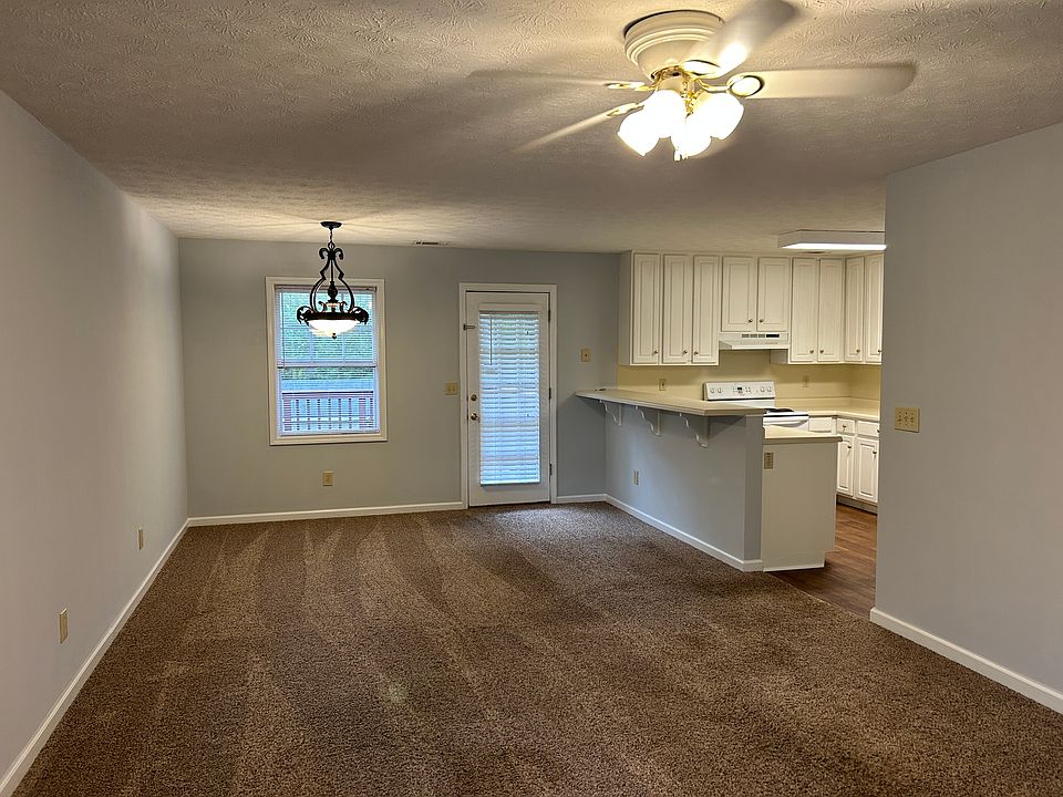 Front door looking to living, dining, and kitchen
