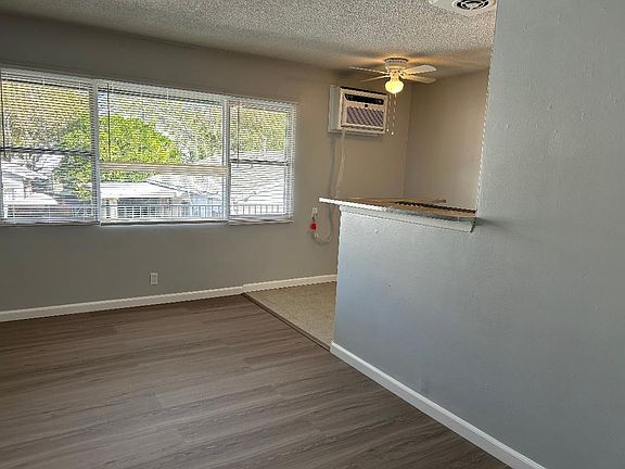 Living Room/Dining room with brand new linemate floor and brand tile floor in the dining area