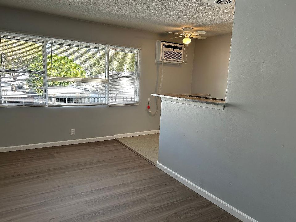 Living Room/Dining room with brand new linemate floor and brand tile floor in the dining area