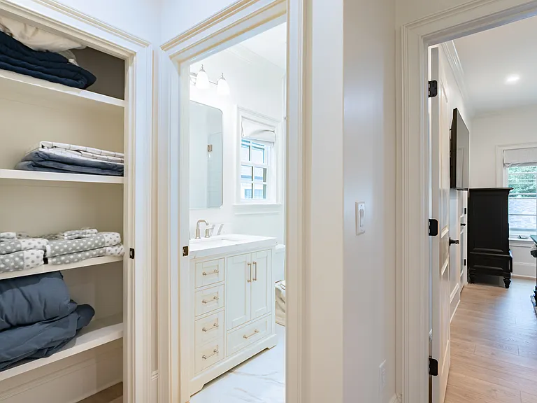 View from hallway of bedroom, bathroom, and linen closet (extra blankets and towels included)