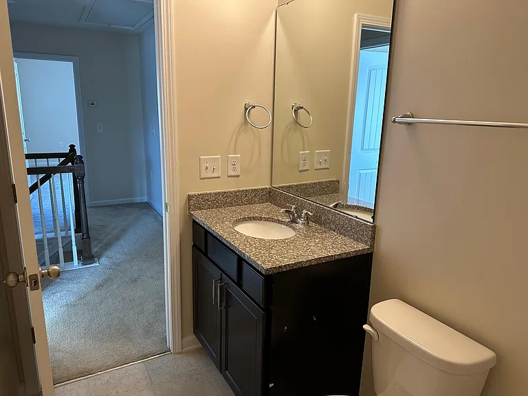 A view from the shower within bathroom 2. Immediately across is the main bedroom, to the immediate left is bedroom 2.