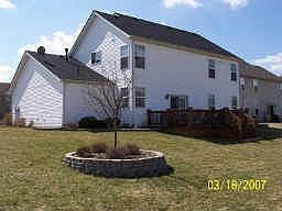 Back w/ deck and professional landscaping