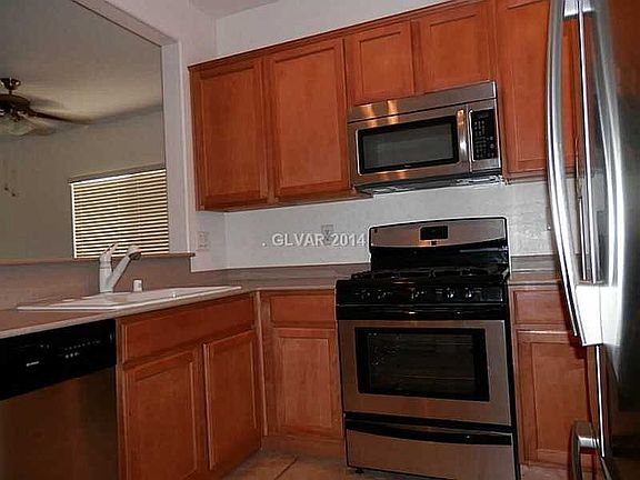 Kitchen: Maple Cabinets.