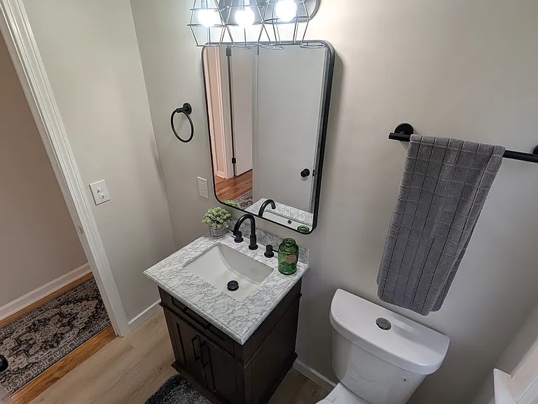 New vanity, light, mirror & toilet