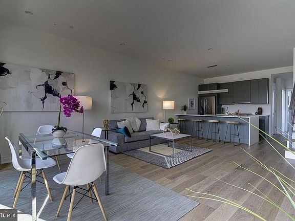 Kitchen and living room, showing staircase up to private roof deck