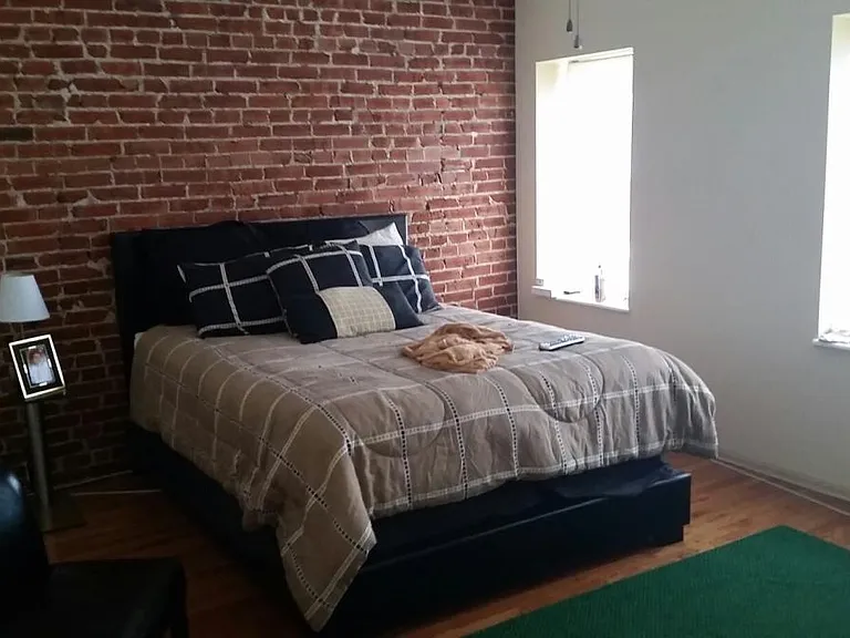 Bedroom with Exposed Brick