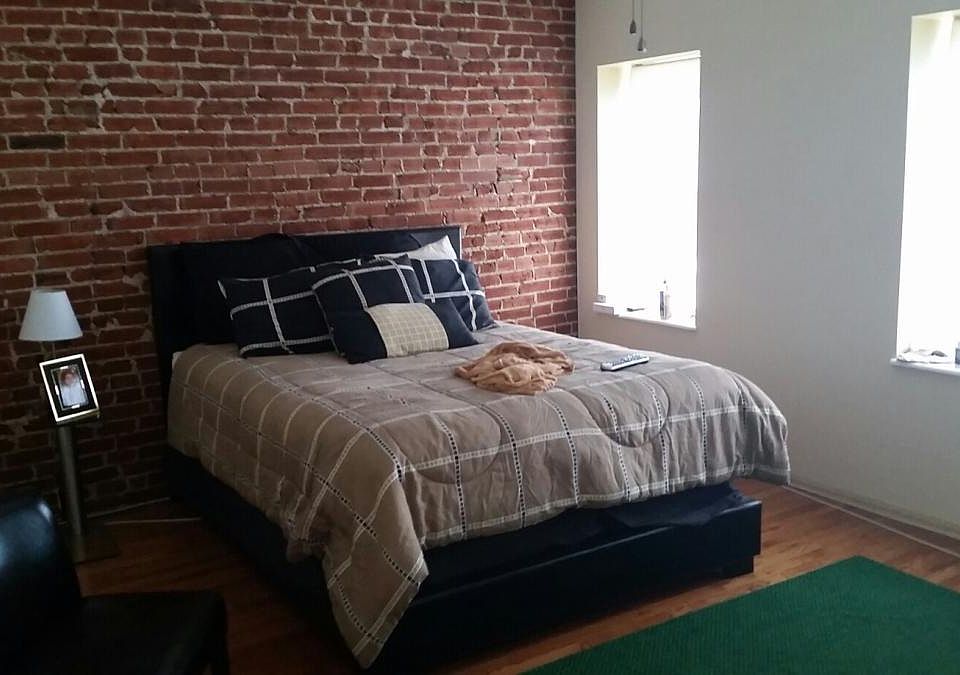 Bedroom with Exposed Brick