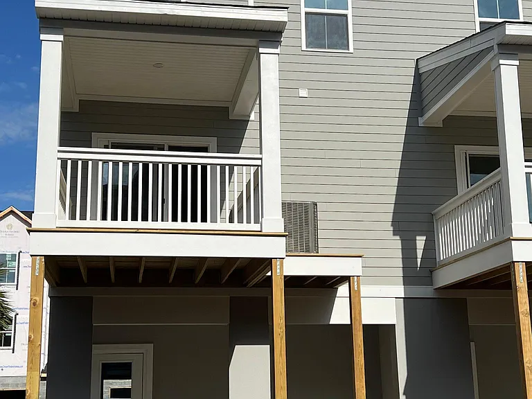 Back of house with patio