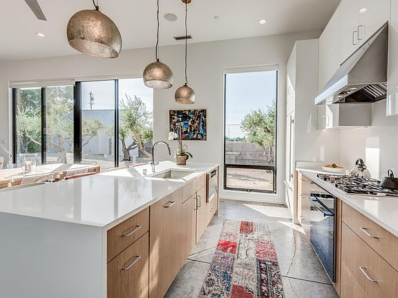 kitchen with view to pool and olive grove